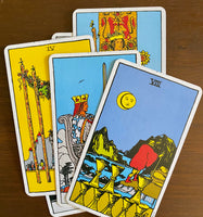 A stack of Tarot cards, with Eight of Cups on top